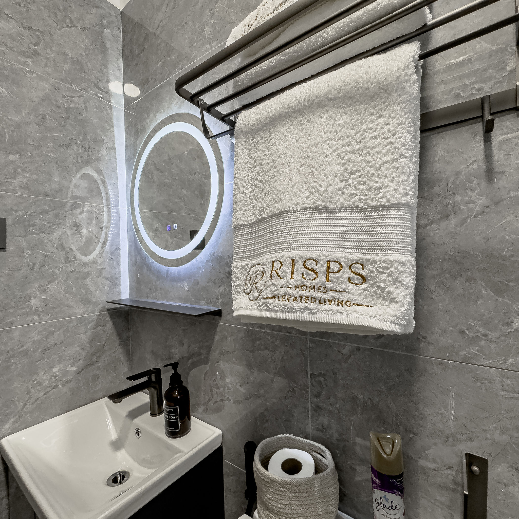 Bathroom with branded towels and vanity