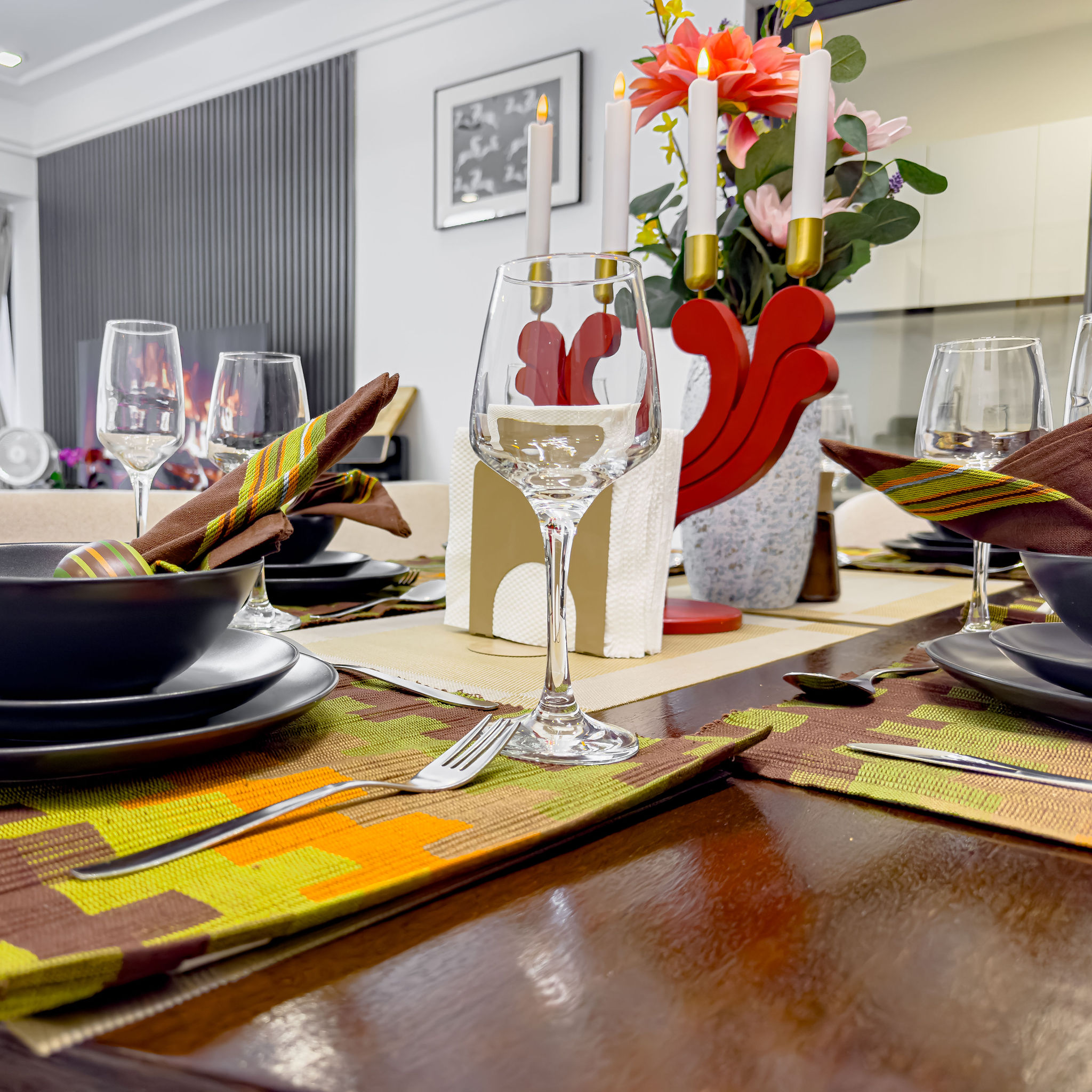 Dining table detail with wine glasses and place settings