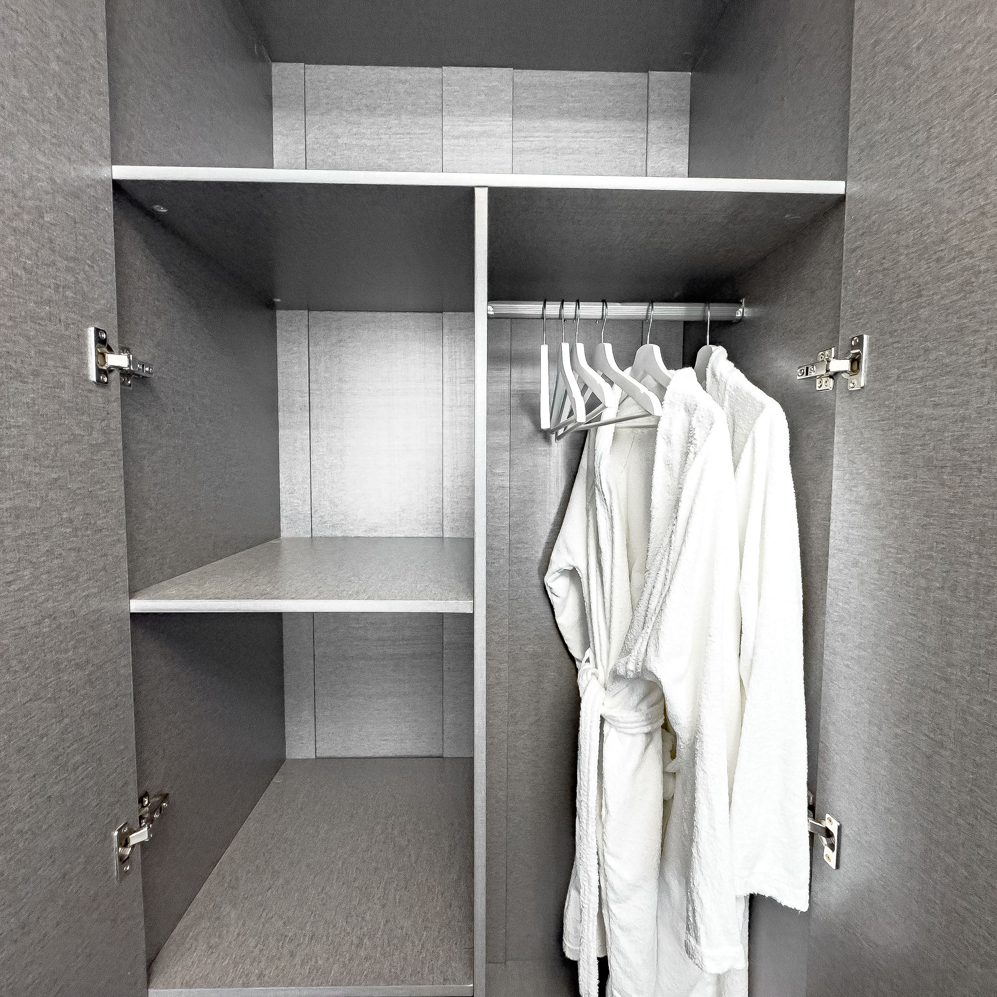 Built-in wardrobe with bathrobes and storage
