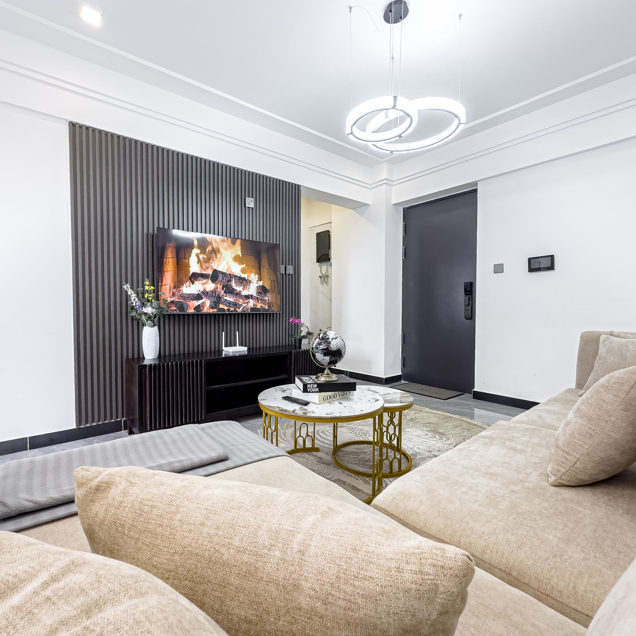 Living room view from entrance with TV feature wall